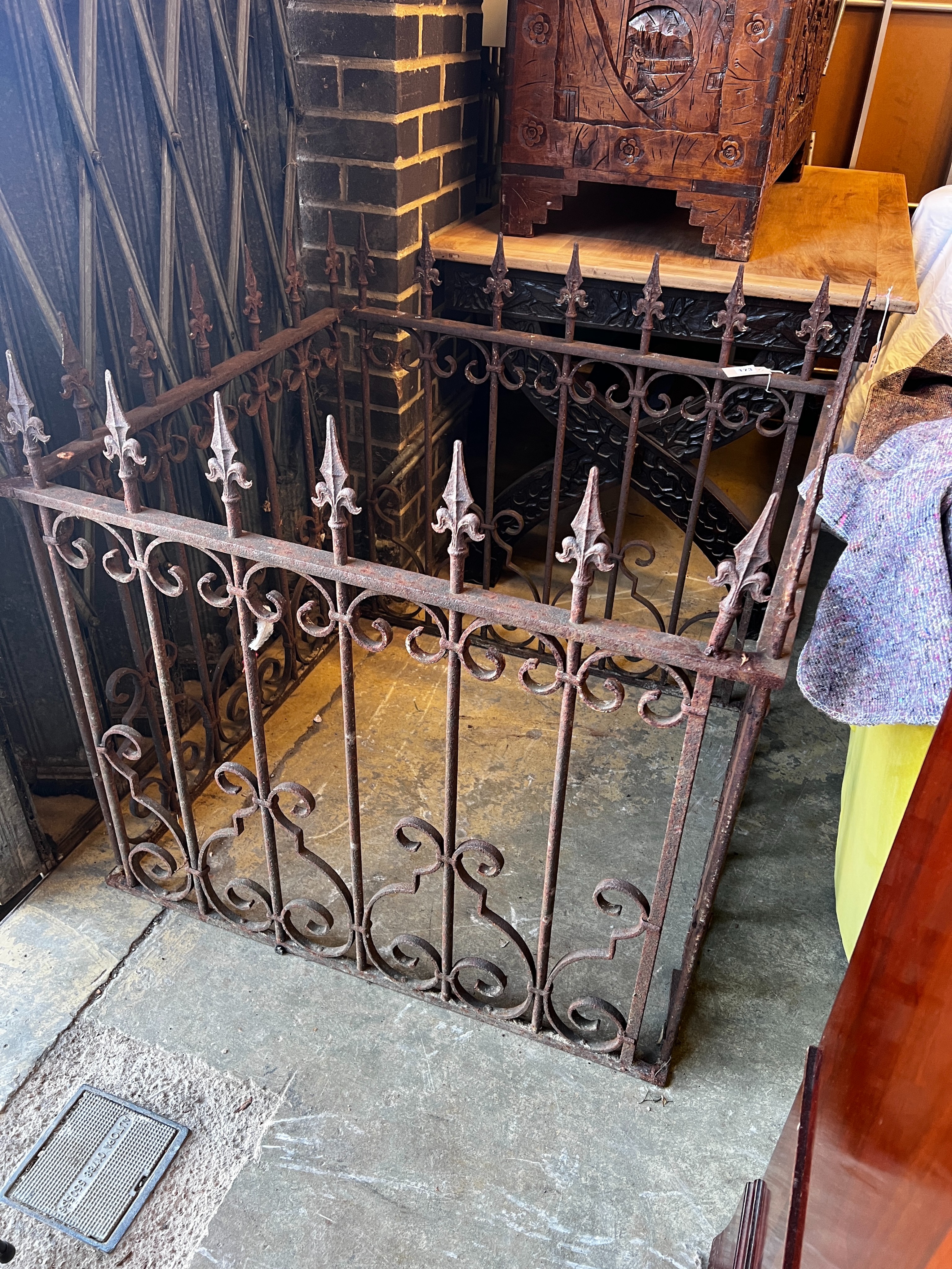 A wrought iron monument surround, width 84cm, depth 92cm, height 85cm